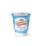 корова